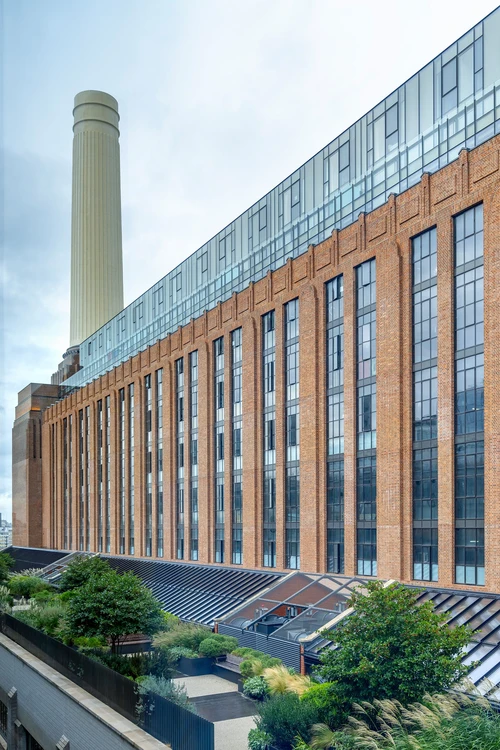 historic industrial building with tall steel windows and doors in a crittall style and a brick facade
