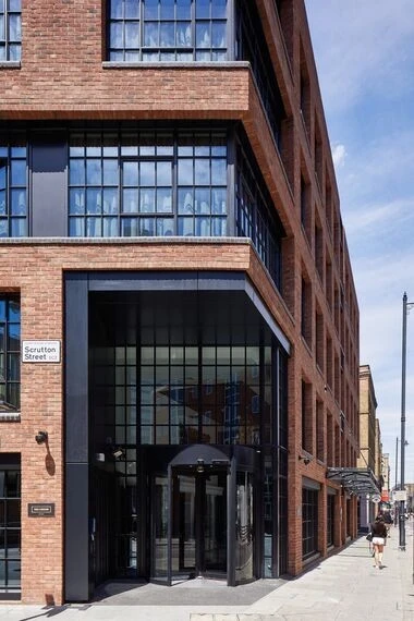 city cafe with black steel doors and large glass panels
