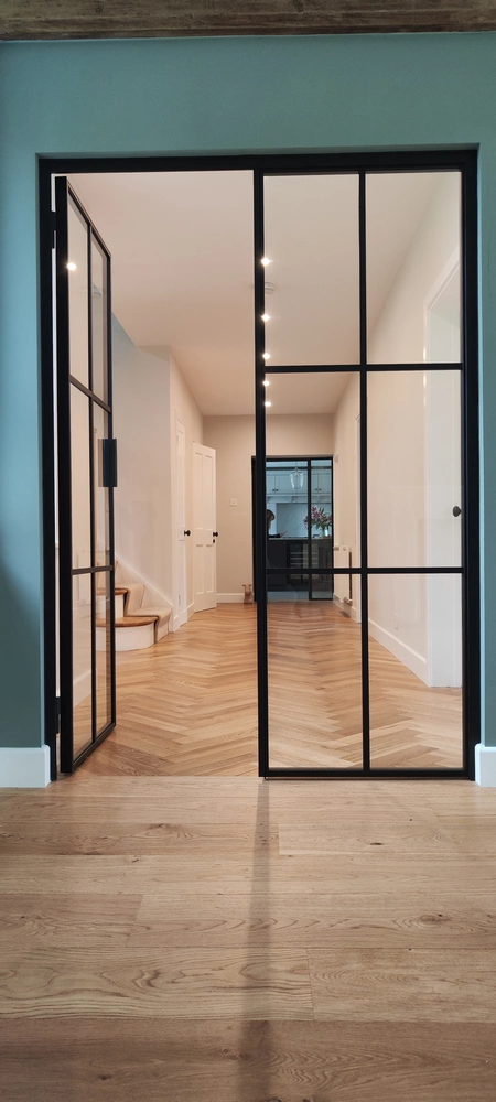 entry hall with crittall internal doors and a modern look