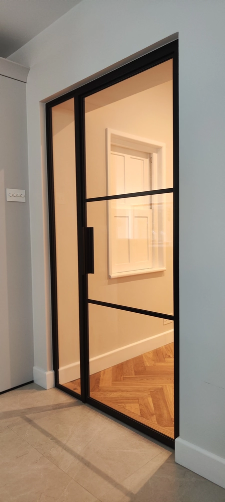 corridor with crittall internal doors and soft beige walls