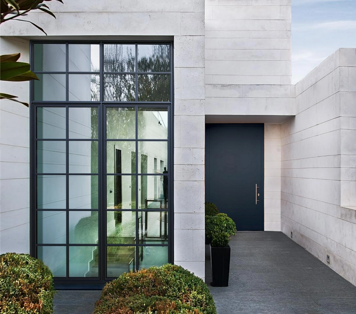 modern home entrance with crittall door and minimalist landscaping