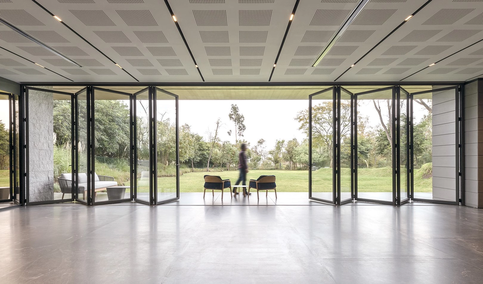 dining area with steel doors and windows and panoramic glass walls