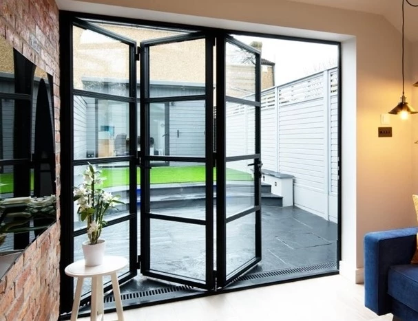 apartment balcony with bifold crittal doors and minimalist railing