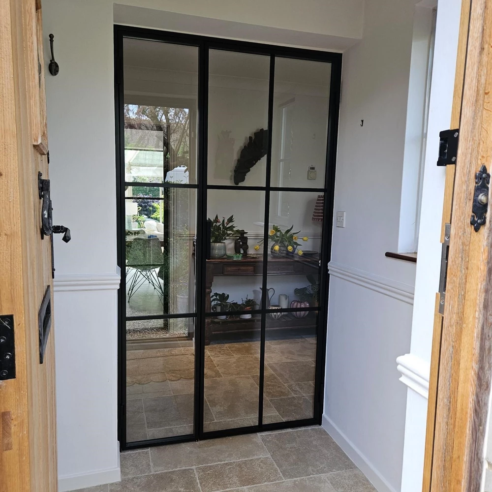 entryway with internal crittall doors and minimalist decor