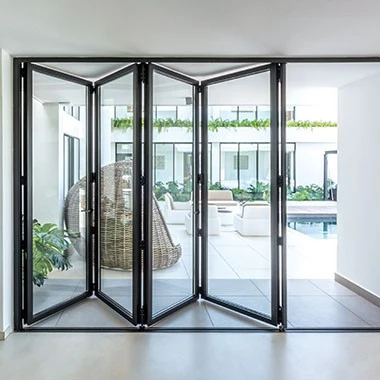 living room with bifold crittal doors and a view to the patio
