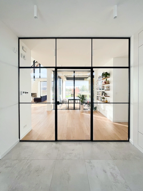 open-plan living area with crittall style bifold doors and large windows