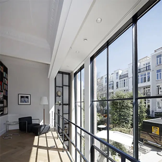 bright apartment hallway with steel windows and doors and balcony access