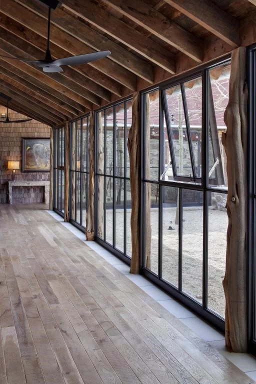 industrial loft with floor-to-ceiling crittall style doors and wood beams