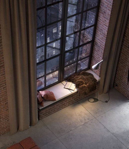 cozy reading nook with crittall style windows and exposed brick