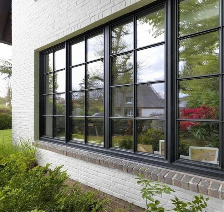 white house featuring steel windows and doors and a garden view